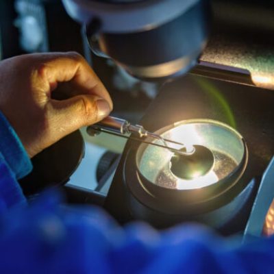 Grading,Clarity,On,Diamonds,,Microscope,And,Magnifing,Glass,,African,Woman