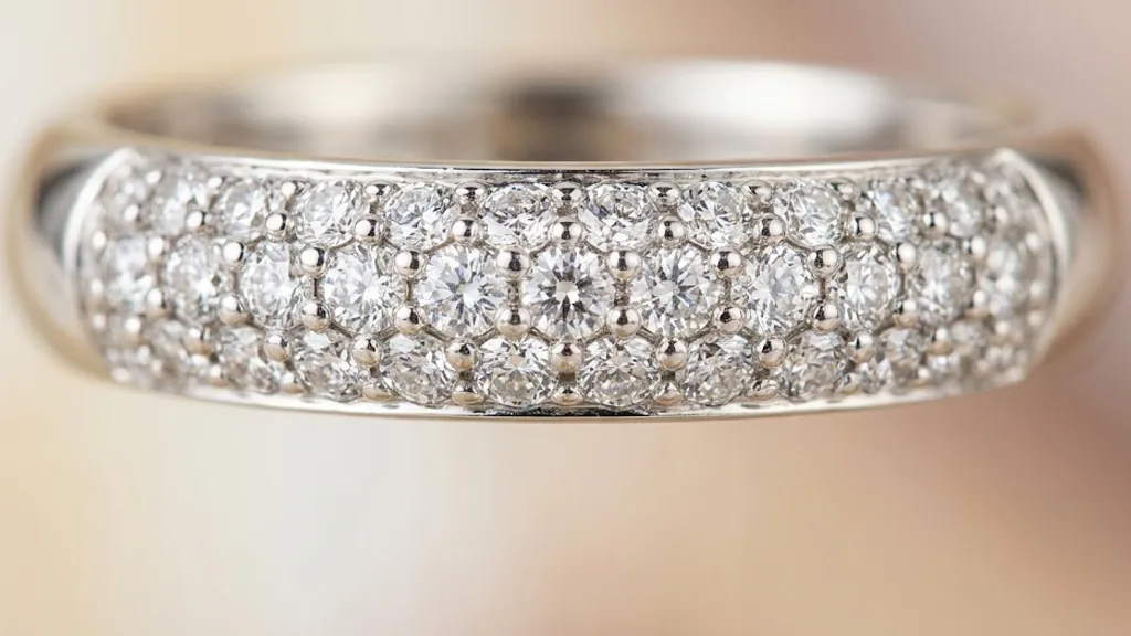 Macro close-up of a pave-set diamond band in white gold